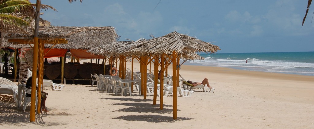 A beach with plenty of sun-loungers on the Nordeste coast. 