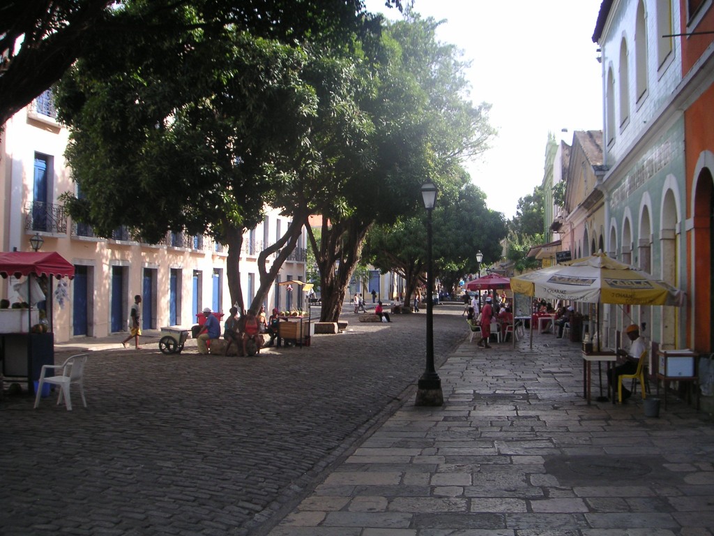 A cobbled Brazilian street lined with trees. 
