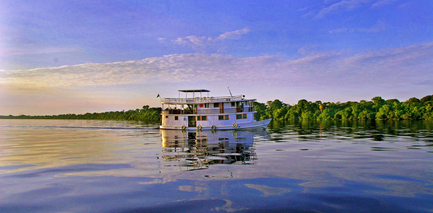 Amazon boat at sunset