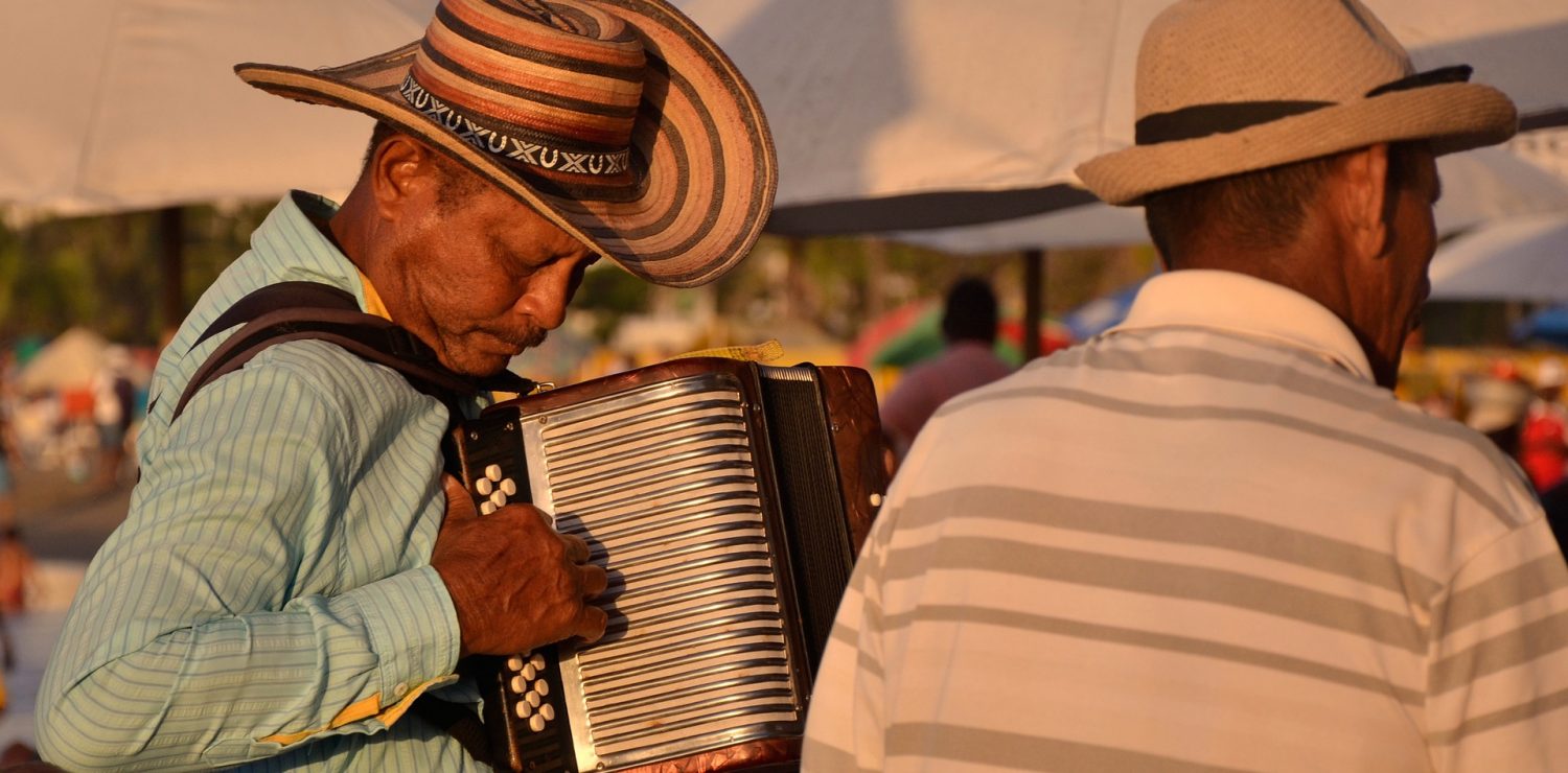 Man plays forro music in the sunset.