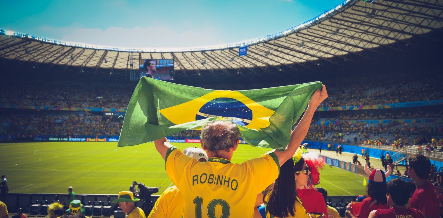 Brazilian football supporter hoists flag