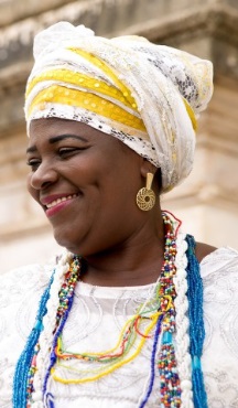 A smiling woman from Bahia in traditional dress.
