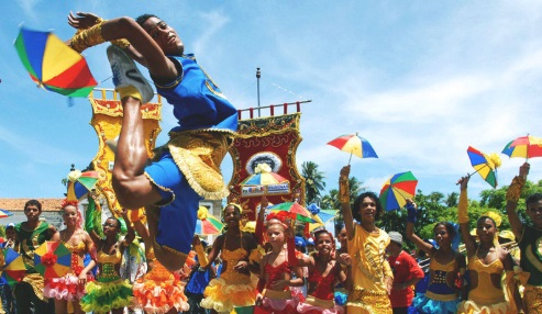 Man jumps excitedly in the air during carnival