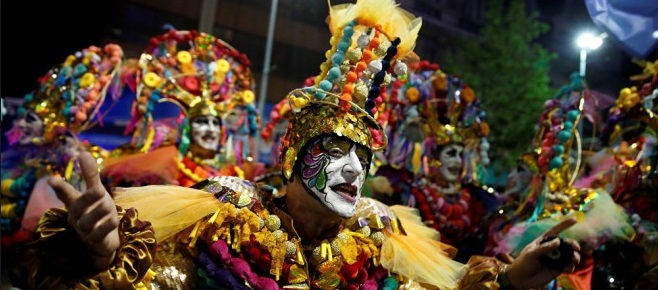 Close-up of dressed up male dancer at carnival.