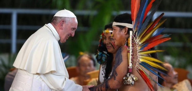 The pope greets native Americans in Brazil.